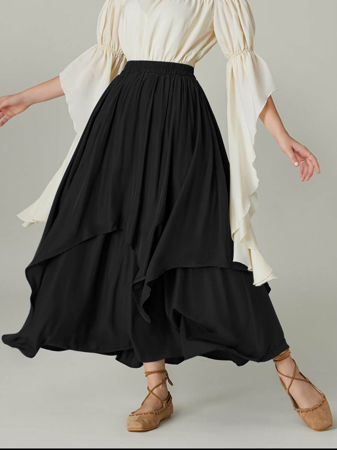 Black Bella Road Smocked Waist Band Ruched Layered Skirt with chic flair and playful design.