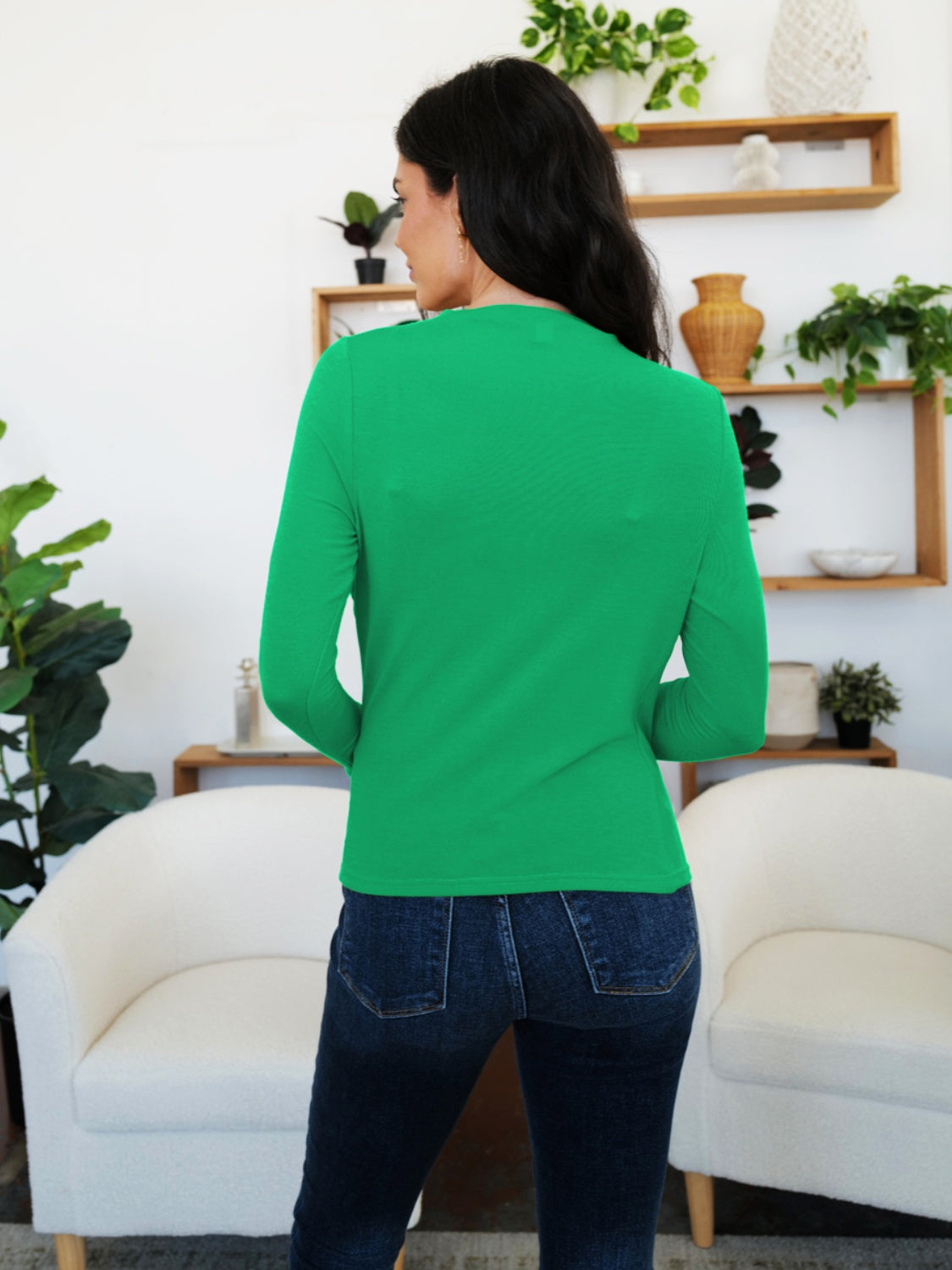 Woman wearing FAM-FAM Ruched Mock Neck Long Sleeve T-Shirt in green, perfect for fall style and layering. Cozy and on-trend.