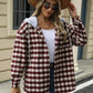 Woman wearing Bella Road Drawstring Plaid Long Sleeve Hooded Jacket with hat and sunglasses, standing in front of a building.