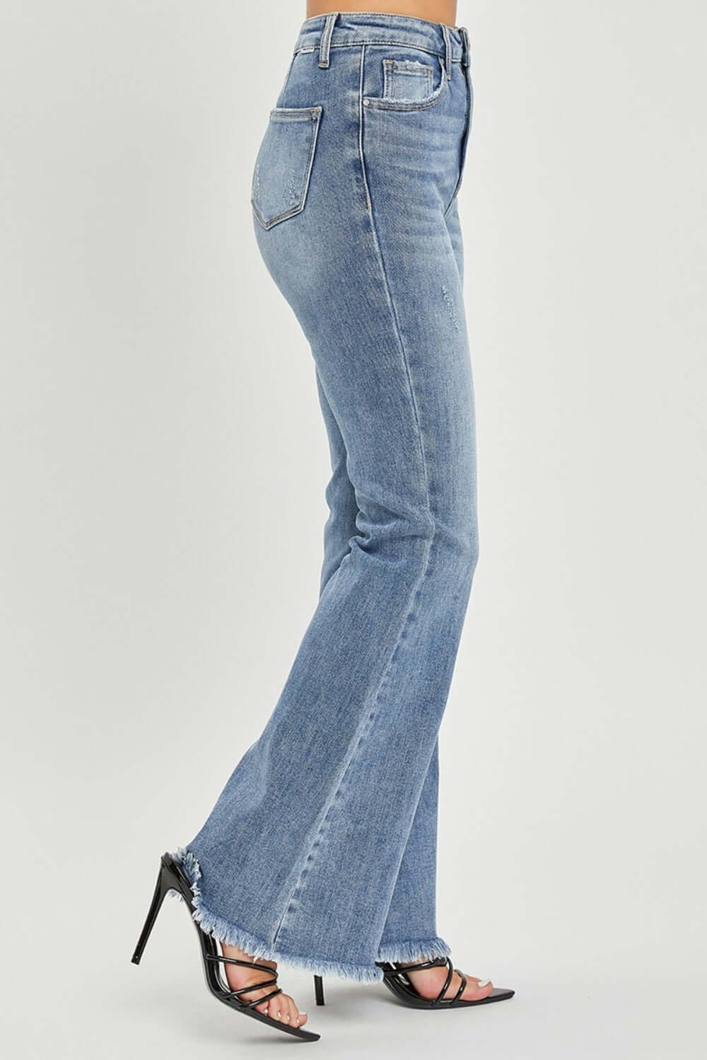 High Waist Raw Hem Flare Jeans with retro-inspired look, raw hem detailing, and flattering fit, featuring quality denim material for comfort and durability.