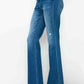 Woman wearing bytos high rise bootcut jeans with pockets, showcasing a flattering fit and stylish silhouette.