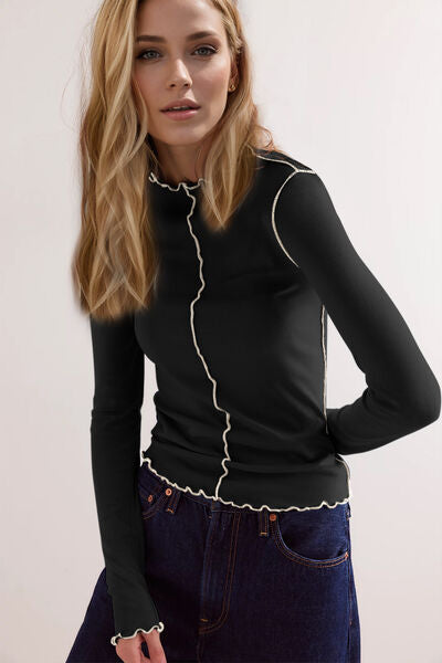 Model showcasing Basic Bae Contrast Trim Mock Neck Long Sleeve T-Shirt with ruffle details against a neutral background.