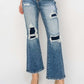 High Rise Distressed Ankle Flare Jeans by Risen Jeans, trendy and chic with high rise fit, distressed details, and ankle flare cut