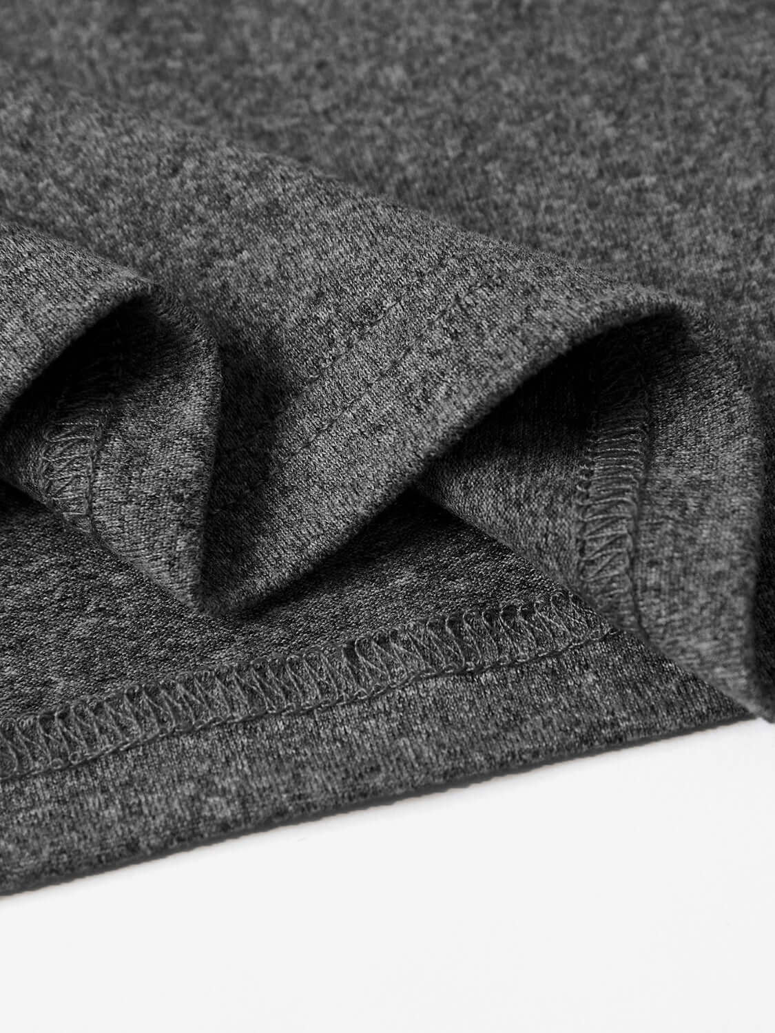 Close-up of the hem of a gray round neck short sleeve t-shirt made of 100% polyester fabric.