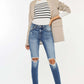 High Waist Distressed Raw Hem Ankle Skinny Jeans styled with a striped top and blazer, perfect for a trendy and edgy look.