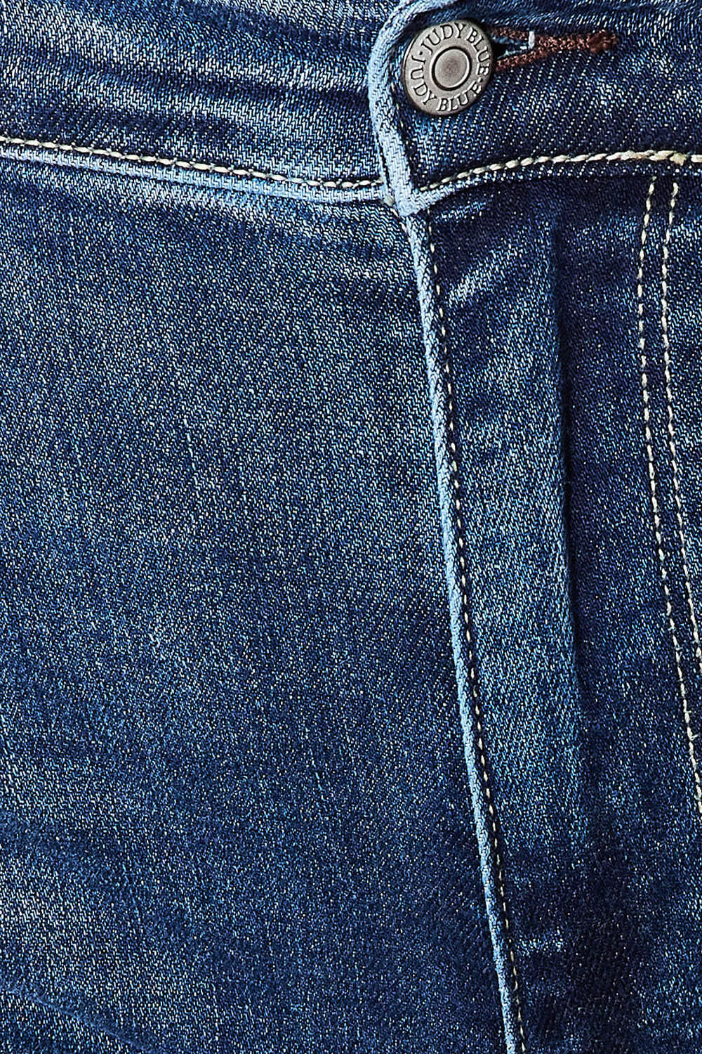 Close-up of mid-rise Judy Blue Jeans showing button and distressed denim fabric texture