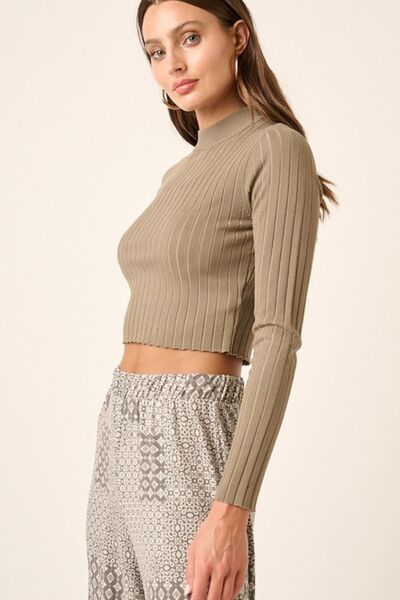 Stylish model showcasing the Mittoshop Mock Neck Long Sleeve Crop Knit Top paired with trendy patterned pants.