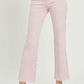 Woman wearing RISEN Full Size High Rise Tummy Control Straight Jeans with raw hem detail in a light pink color.