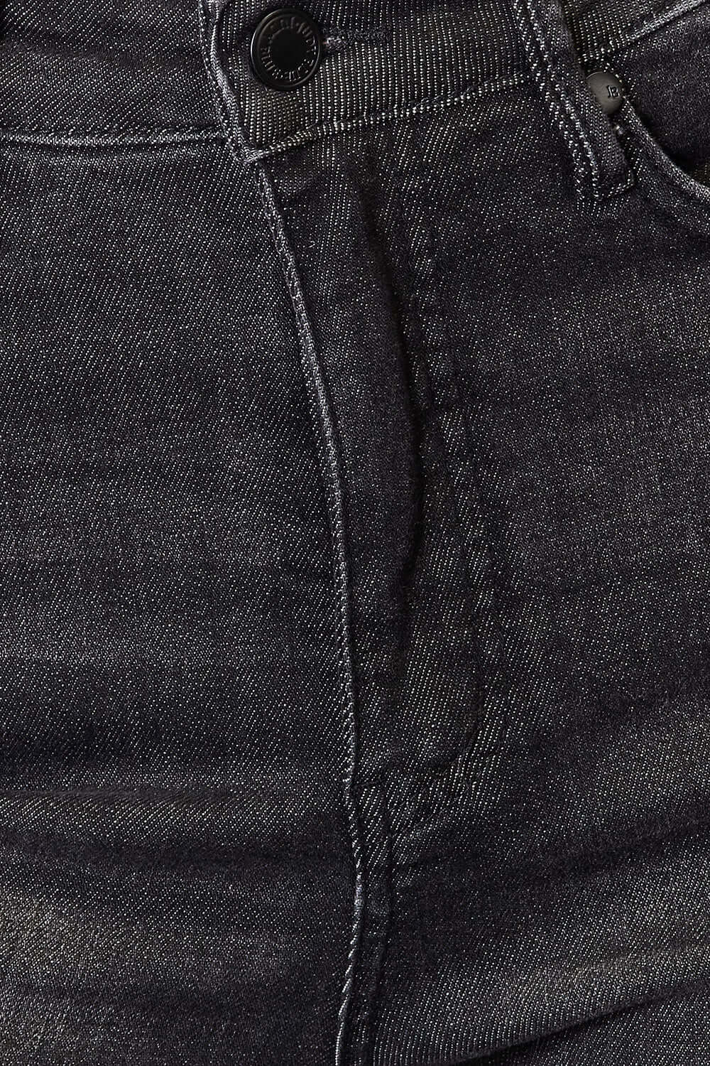 Close-up of tummy control high waist black denim jeans showing front pocket and waistband stitching.