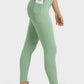 Millennia V-Waist Yoga Leggings in green featuring a side pocket, perfect for a stylish and comfortable workout.