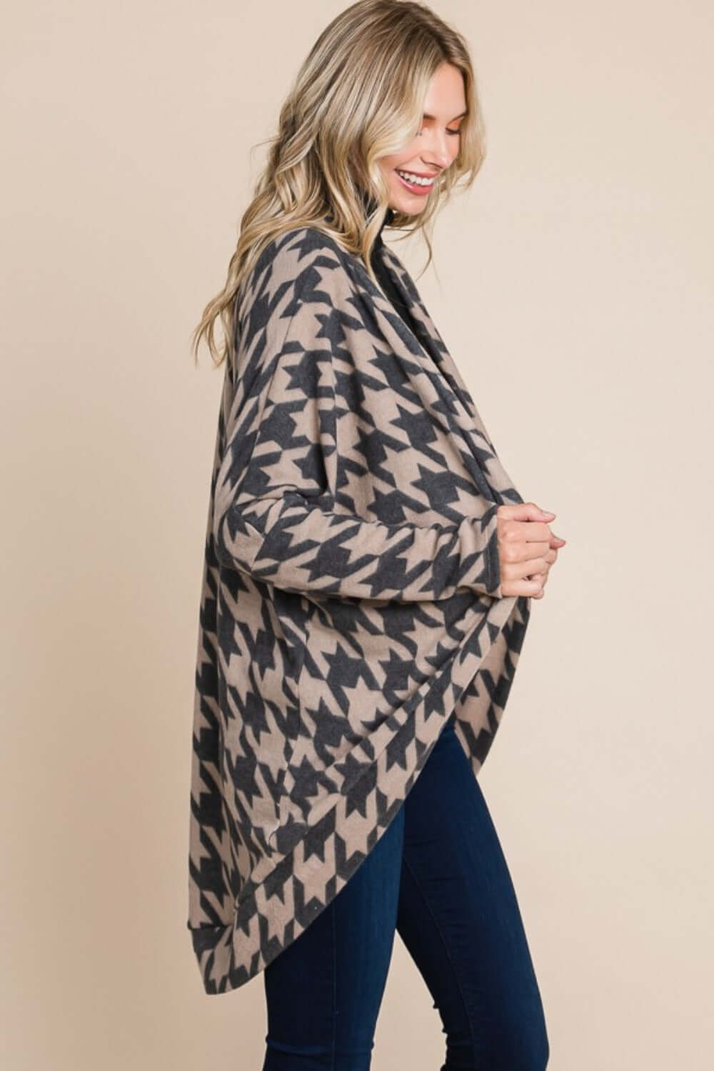 Woman wearing a BOMBOM houndstooth cocoon knit cardigan with open front design, showcasing its chic and cozy style.