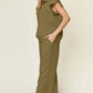 Woman wearing a Texture Ruffle Short Sleeve Top and Drawstring Wide Leg Pants Set in army green, featuring pockets and a relaxed fit.