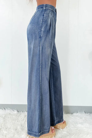 High Waist Wide Leg Jeans in blue denim, side view showing flattering fit and stylish design on a woman