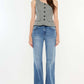 Woman wearing Ultra High Rise Cat's Whiskers Jeans, showcasing chic high-waisted silhouette with vintage detailing, perfect for versatile styling.