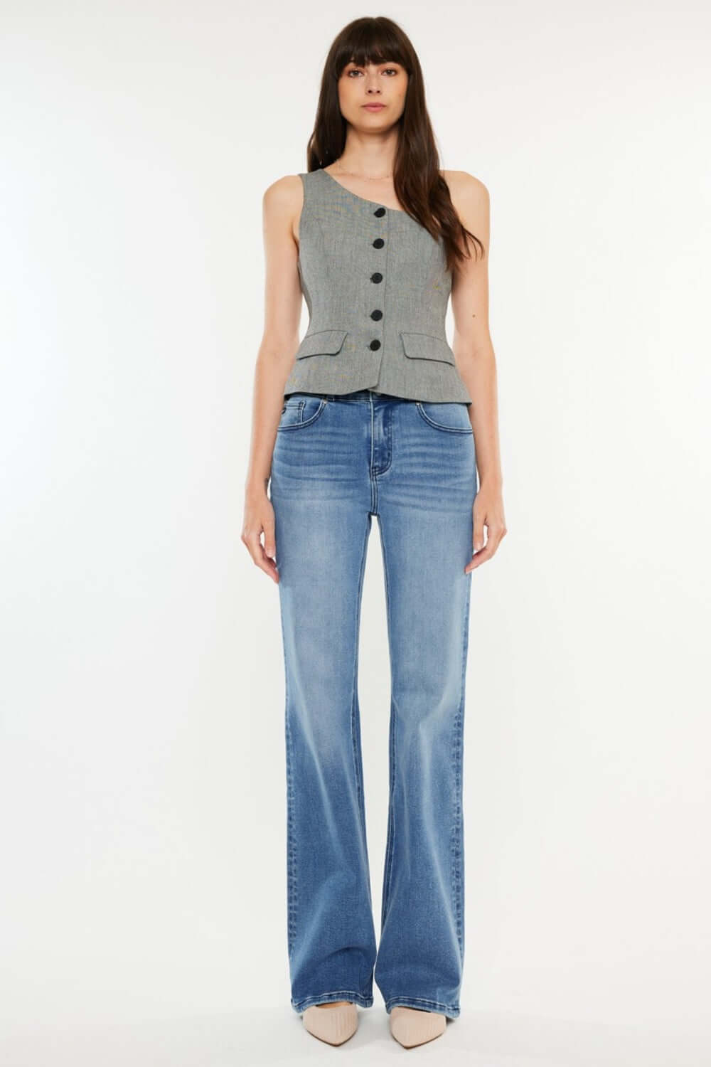 Woman wearing Ultra High Rise Cat's Whiskers Jeans, showcasing chic high-waisted silhouette with vintage detailing, perfect for versatile styling.