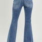 Back view of high waist distressed flare jeans with Risen Jeans branding showcasing trendy urban chic style and vintage-inspired flare legs.