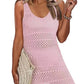 Playful woman in pink openwork scoop neck cover-up, perfect for beach days and sun-filled adventures.