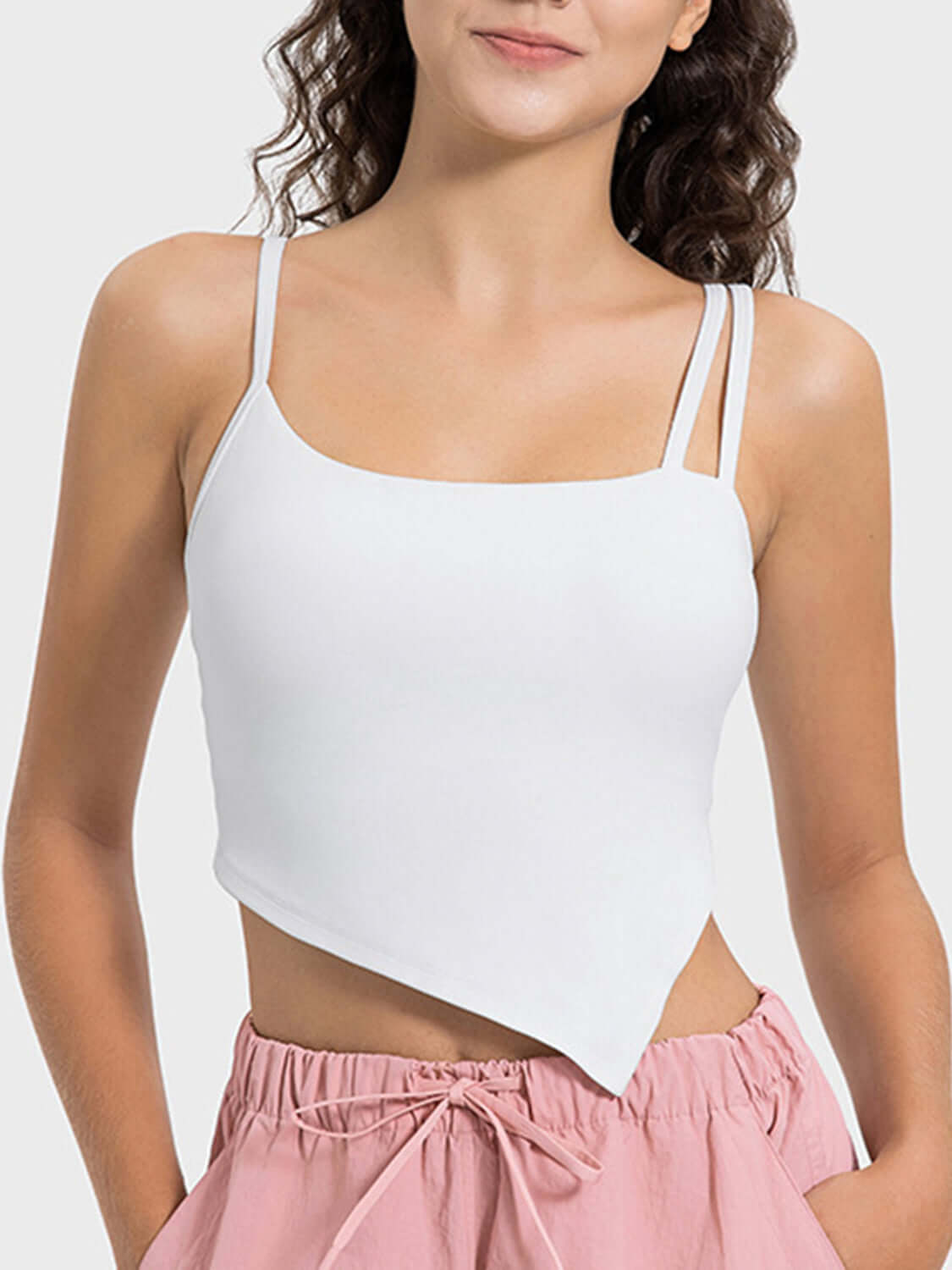 Stylish Millennia Slit Asymmetrical Neck Active Cami in white, perfect for workouts and trendy outings.