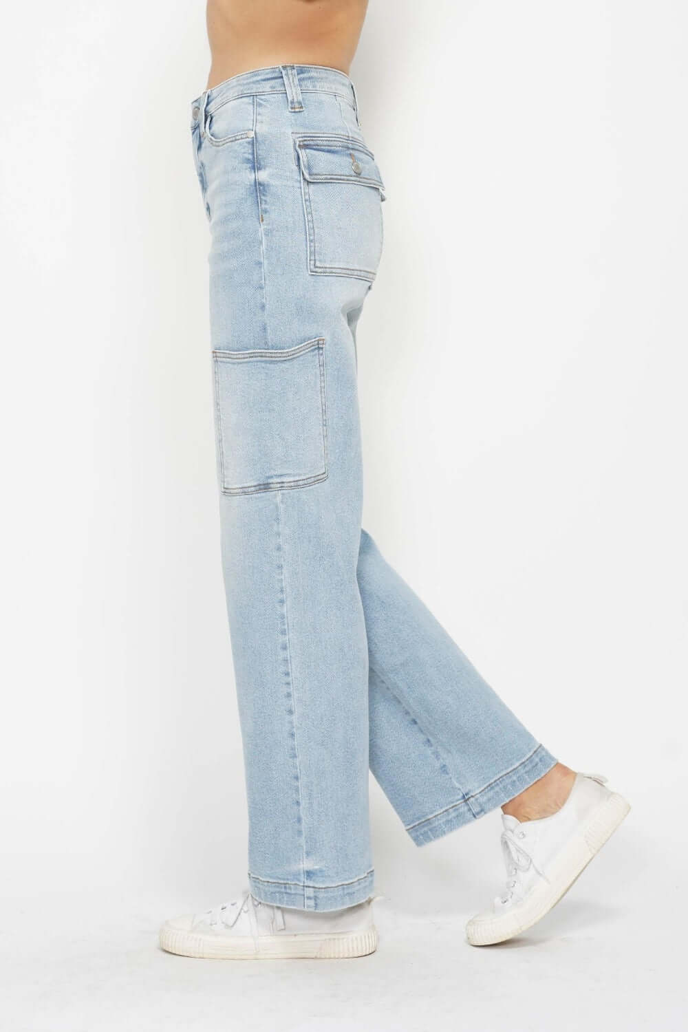 High waist straight cargo jeans by Judy Blue Jeans with multiple pockets, light denim color, and comfortable fit, paired with white sneakers.