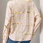 Woman wearing Perfee's tan long sleeve shirt with gold print, collared neck, and jeans, showcasing elegant fashion style.