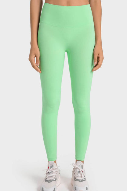 Millennia High-Rise Wide Waistband Yoga Leggings in vibrant green, perfect for yoga practice and comfortable fit.