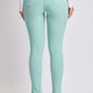 Back view of a model wearing mint green Hyperstretch Mid-Rise Skinny Jeans by YMI Jeans, showcasing a flattering fit and stylish design.