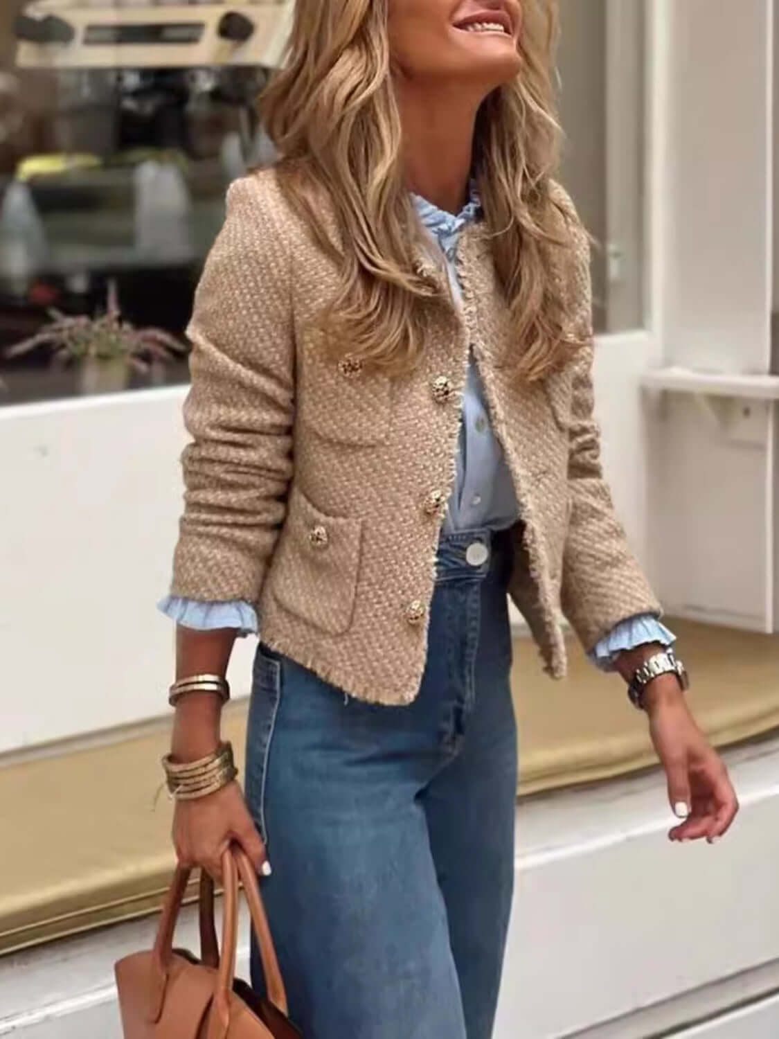 Woman wearing Bella Road Raw Hem Pocketed Round Neck Jacket with jeans and carrying a handbag, showcasing a trendy and stylish look.