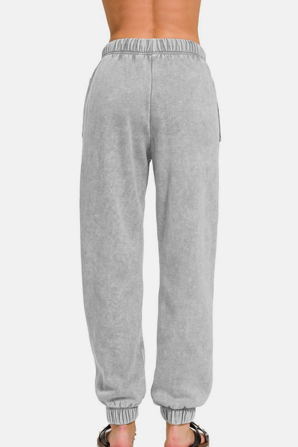 Zenana acid wash fleece drawstring sweatpants in gray, featuring pockets and elastic waist, showcasing casual comfort and style.