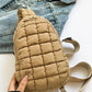 Bella Road Quilted Nylon Crossbody Bag in beige with denim jacket background, lightweight and stylish for any adventure.