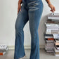 Woman wearing Bella Road Mid Rise Bootcut Jeans, featuring a stylish fit and functional pockets for everyday adventures.