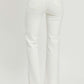 White high-rise straight jeans with raw hem and pocket details, shown from the back, paired with clear block heels.