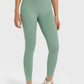 Model wearing Millennia High Waist Ankle-Length Yoga Leggings in green, perfect for yoga and stylish workouts.