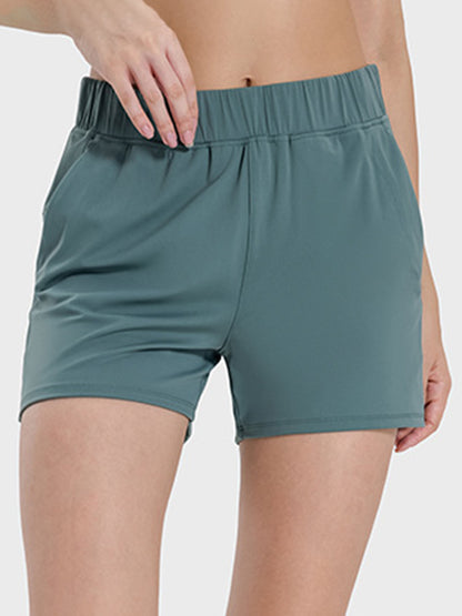 Millennia Elastic Waist Active Shorts in green, featuring a comfortable stretch and sleek design for active wear.