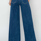 Back view of high rise palazzo jeans with a wide-legged silhouette by Risen Jeans.