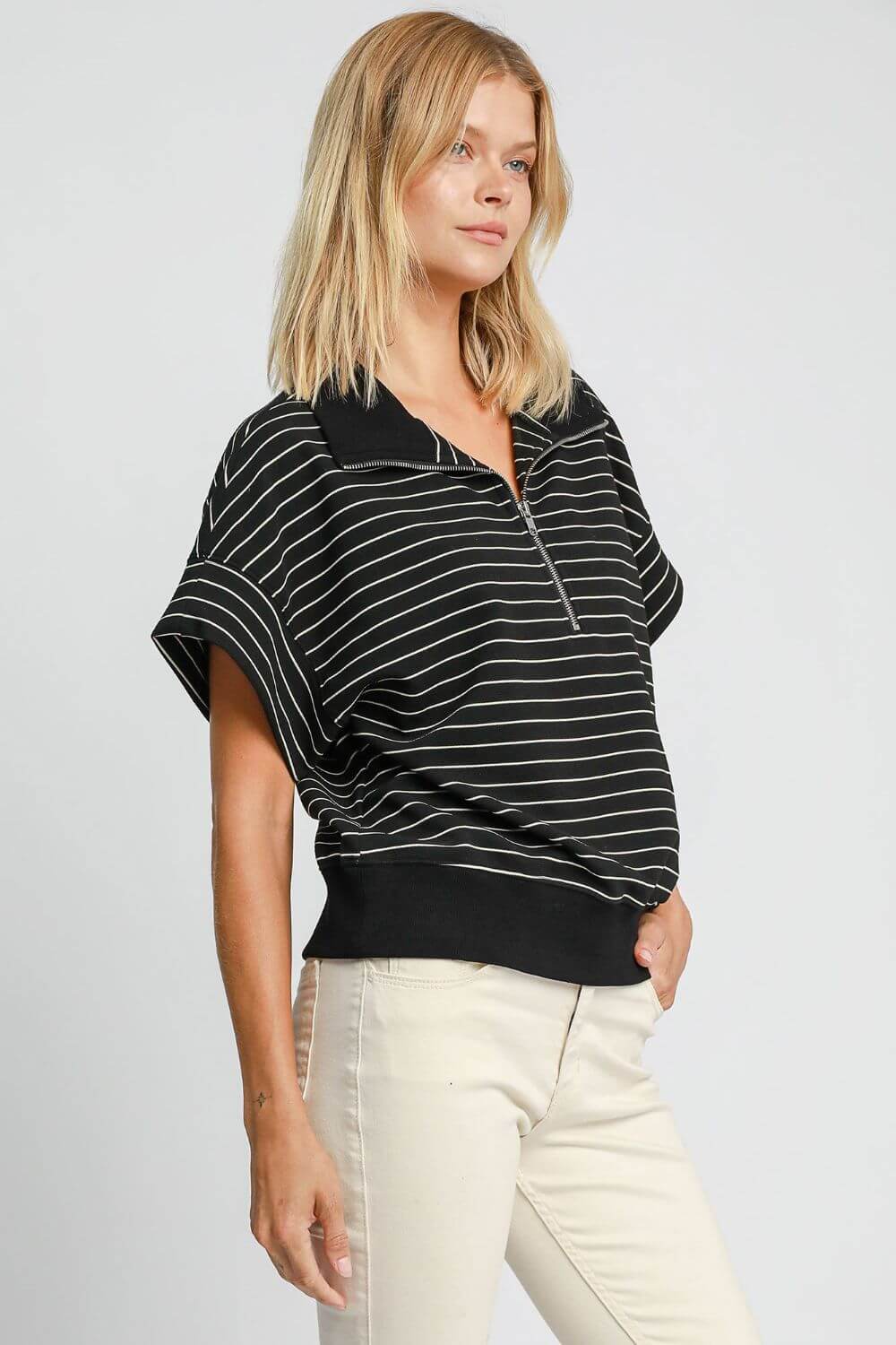 Stylish Umgee striped half zip short sleeve sweatshirt for spring and summer, perfect for sports and leisure activities.