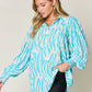 DOUBLE TAKE Full Size Printed Smocked Long Sleeve Blouse at Bella Road