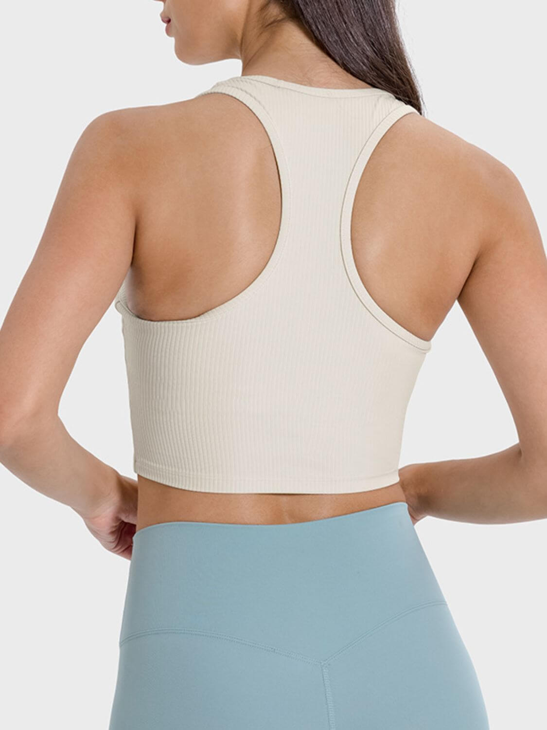 Back view of the Millennia Scoop Neck Wide Strap Active Tank in beige, showcasing its stylish design and supportive fit.