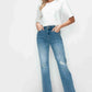 Model wearing bytos distressed high rise straight jeans with a white top, showcasing a flattering fit and edgy style.