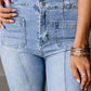 Petite high waist bootcut jeans with pockets, light denim, close-up view.