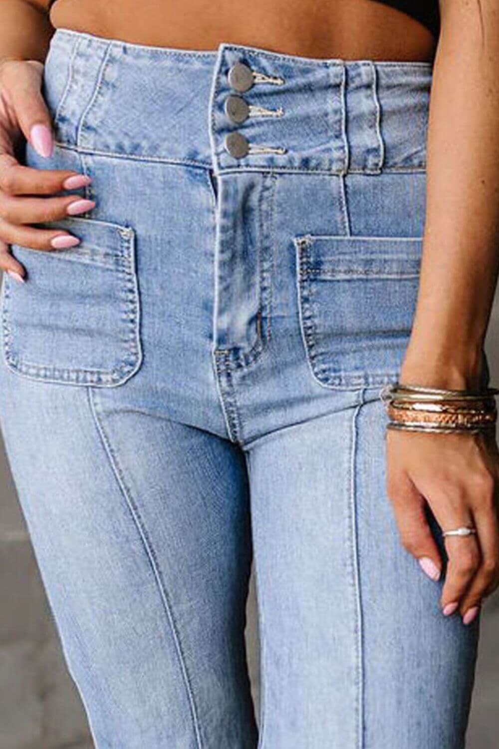 Petite high waist bootcut jeans with pockets, light denim, close-up view.