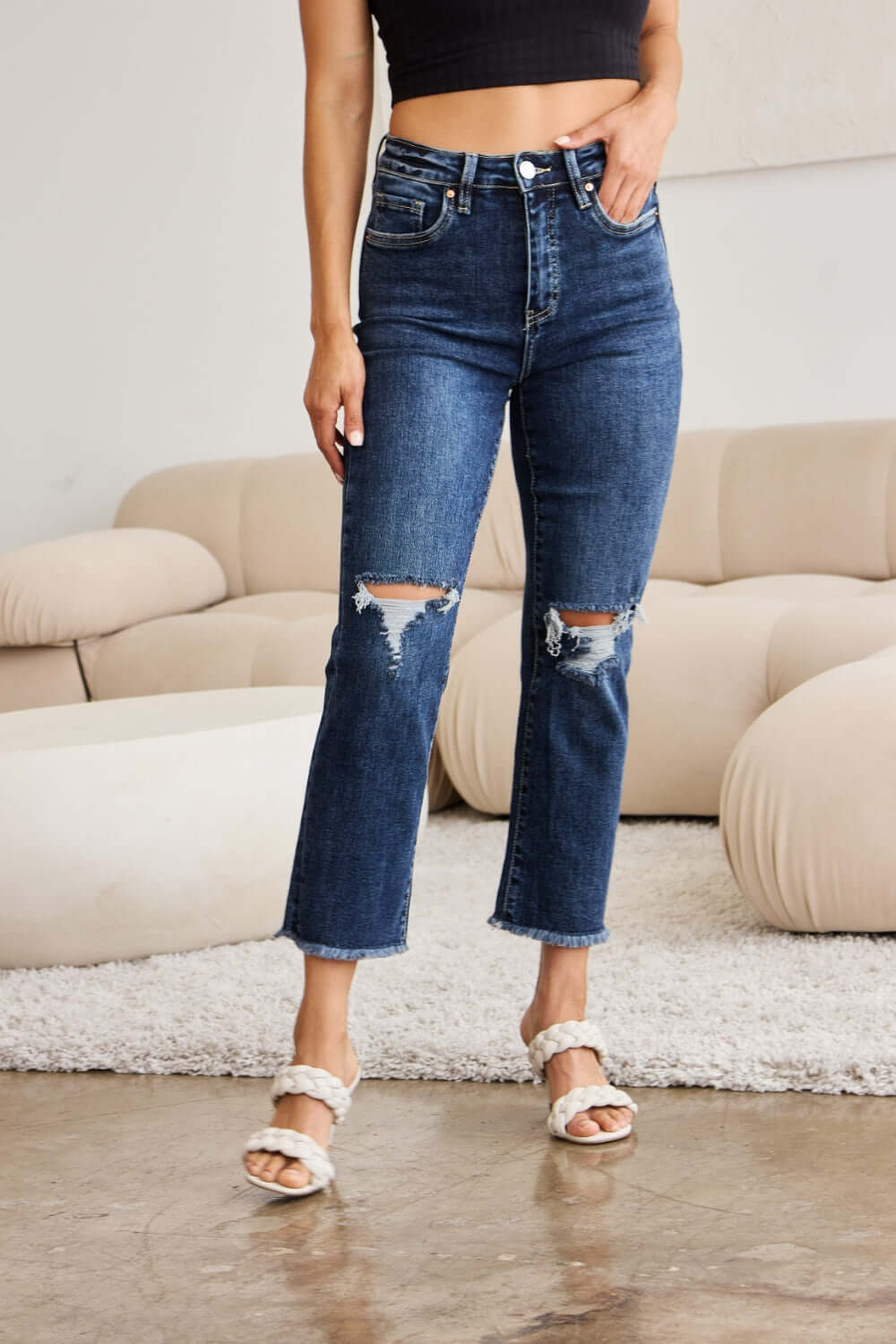 Woman wearing Crop Dylan Full Size Tummy Control Distressed High Waist Raw Hem Jeans by RFM Jeans