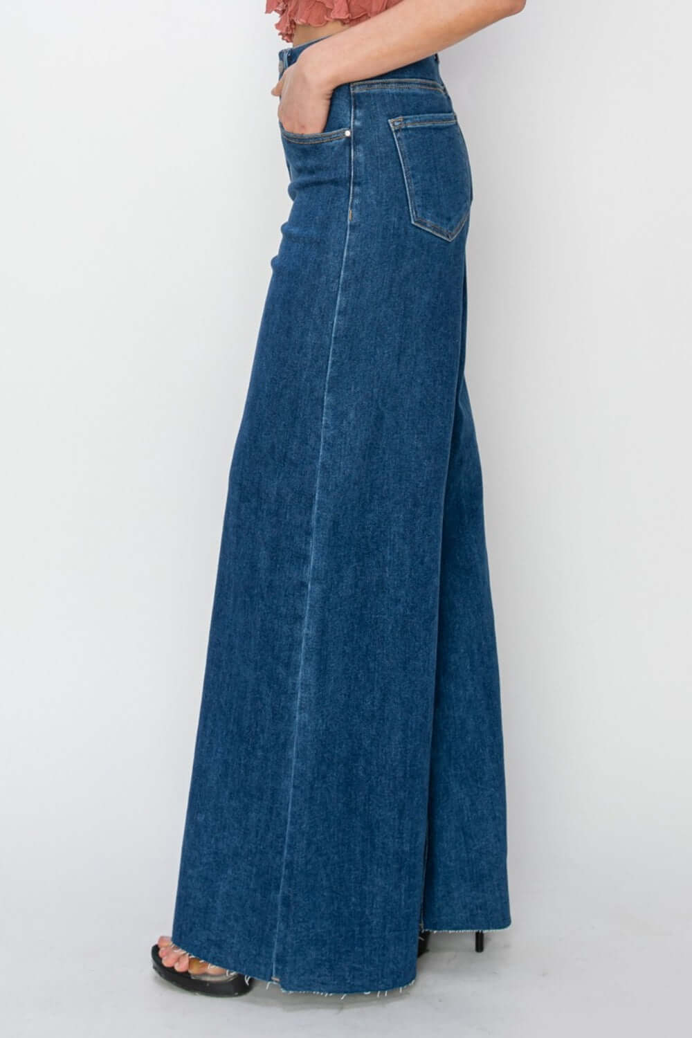 High rise palazzo jeans by Risen Jeans with wide-legged silhouette, high-waisted fit, and elegant denim for a flattering look