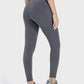 Stylish Millennia Pocketed High Waist Active Leggings in gray, showcasing a flattering fit for workouts and casual wear.