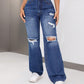 Distressed Jeans with Pockets, showcasing edgy distressing and roomy pockets, styled with a crop top and sneakers.