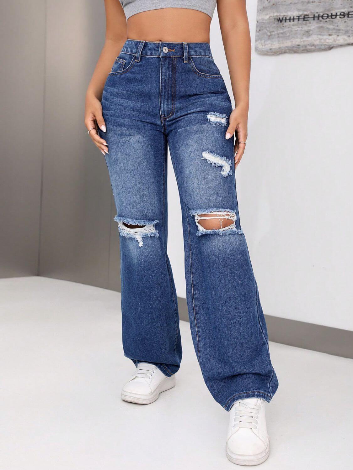 Distressed Jeans with Pockets, showcasing edgy distressing and roomy pockets, styled with a crop top and sneakers.