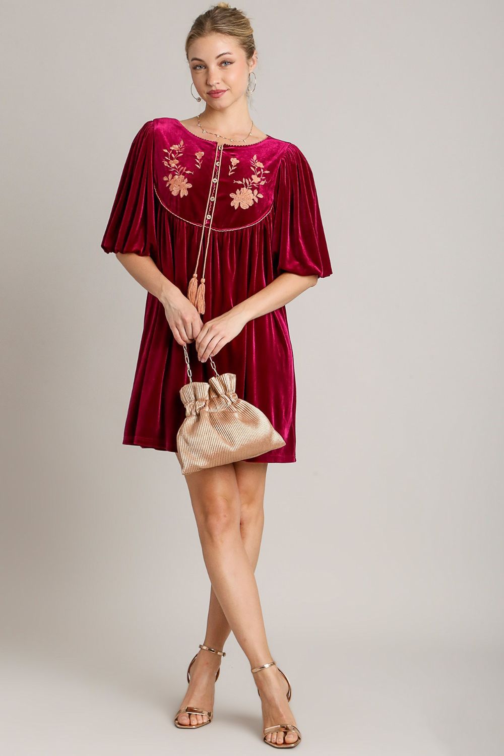 Elegant Umgee embroidered half sleeve velvet mini dress with tassels, paired with a chic handbag for a stylish look.