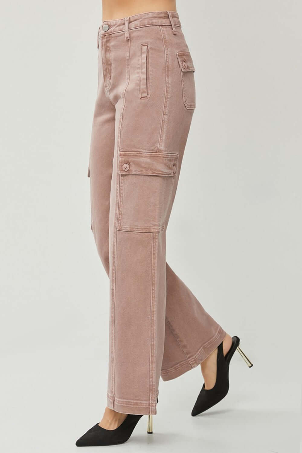 Stylish full size high rise wide leg cargo jeans in pink, featuring cargo pockets and a modern silhouette, paired with black heels.