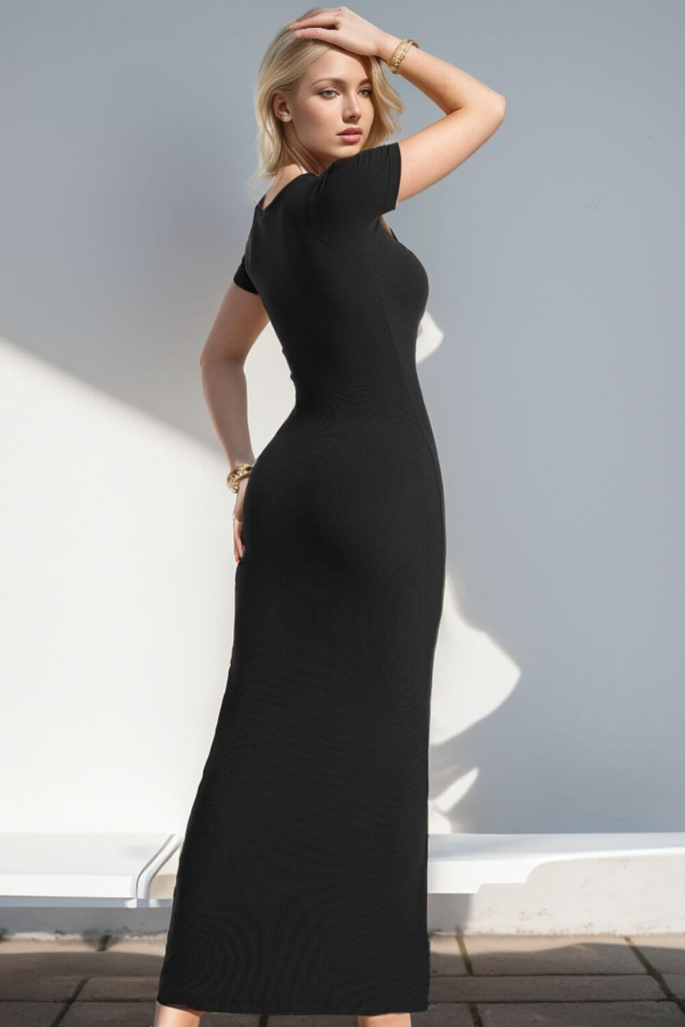 Woman wearing Basic Bae Built-In Shapewear Square Neck Short Sleeve Maxi Dress in black, showcasing the back design and fit.