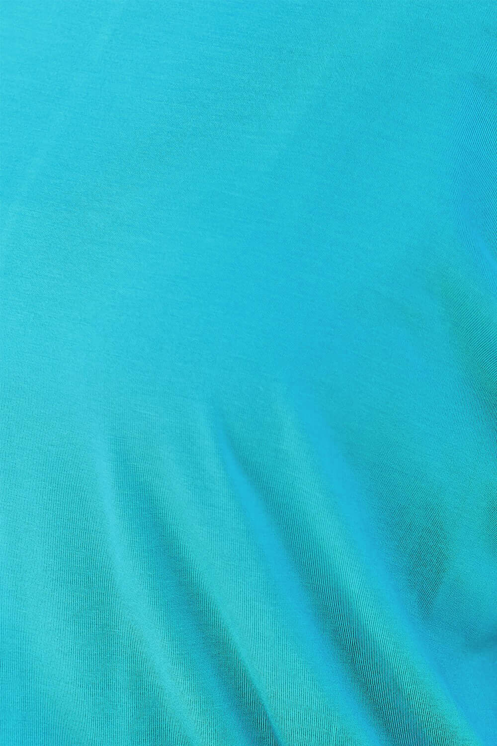 Close-up fabric detail of a turquoise round neck batwing sleeve top, made of 95% rayon and 5% spandex.