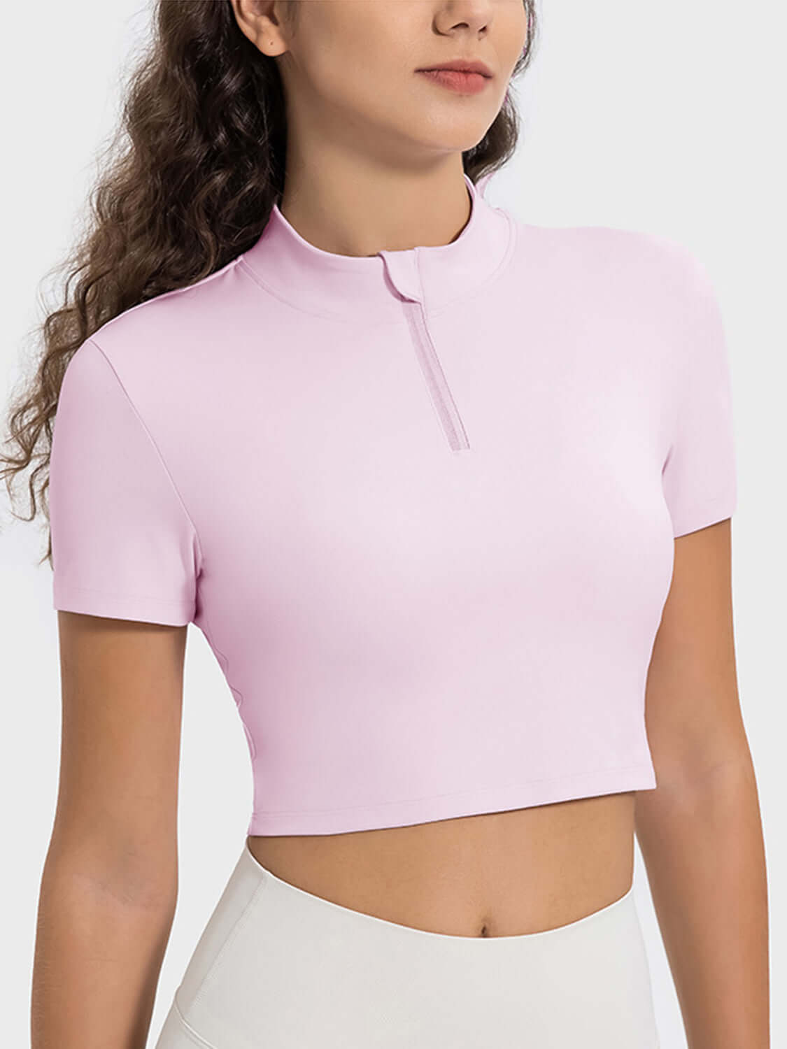 Millennia Quarter Zip Short Sleeve Active T-Shirt in soft pink, perfect for workouts and outdoor activities.